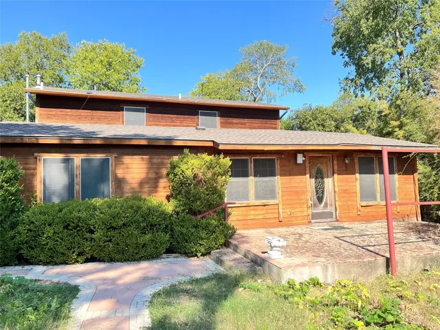 a front view of a house with a porch