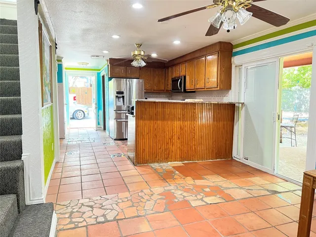 a view of a entryway door with interior in the kitchen