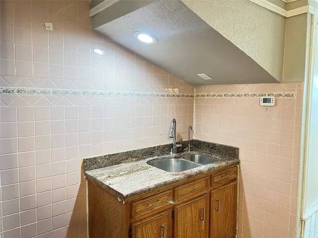 a bathroom with a sink a vanity and mirror