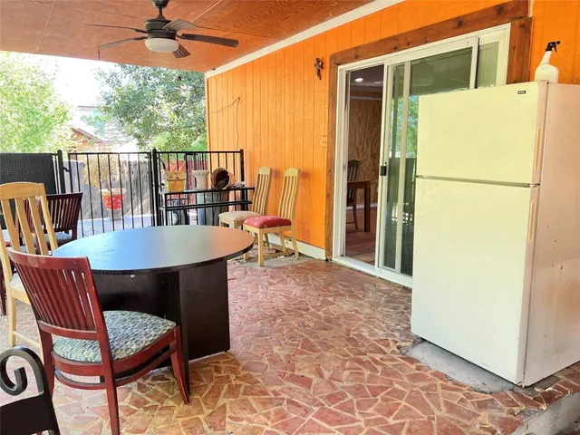 a dining room with furniture and a yard
