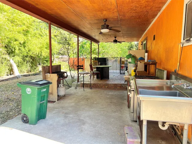 a dining room with furniture and a floor to ceiling window