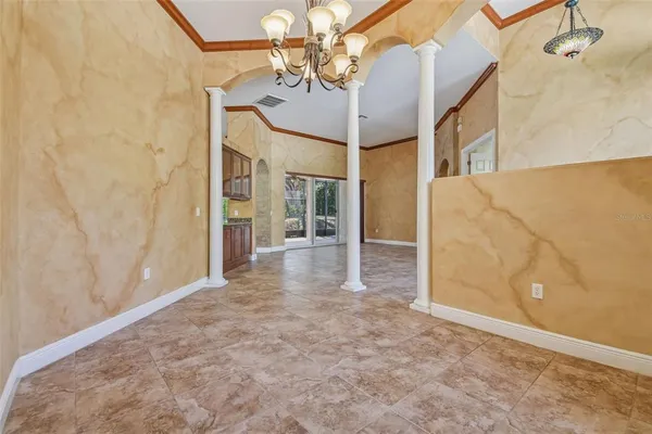 a large kitchen with stainless steel appliances granite countertop a large counter top and a stove top oven