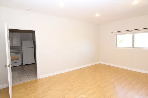 a view of a lake with houses in the back