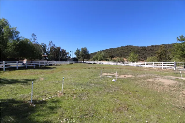 a view of a patio with a table chairs and a backyard