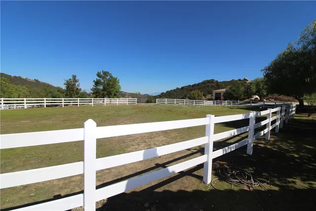 a view of balcony with table and chairs