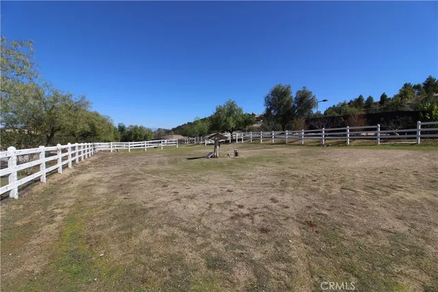 a view of an empty room with wooden roof and windows