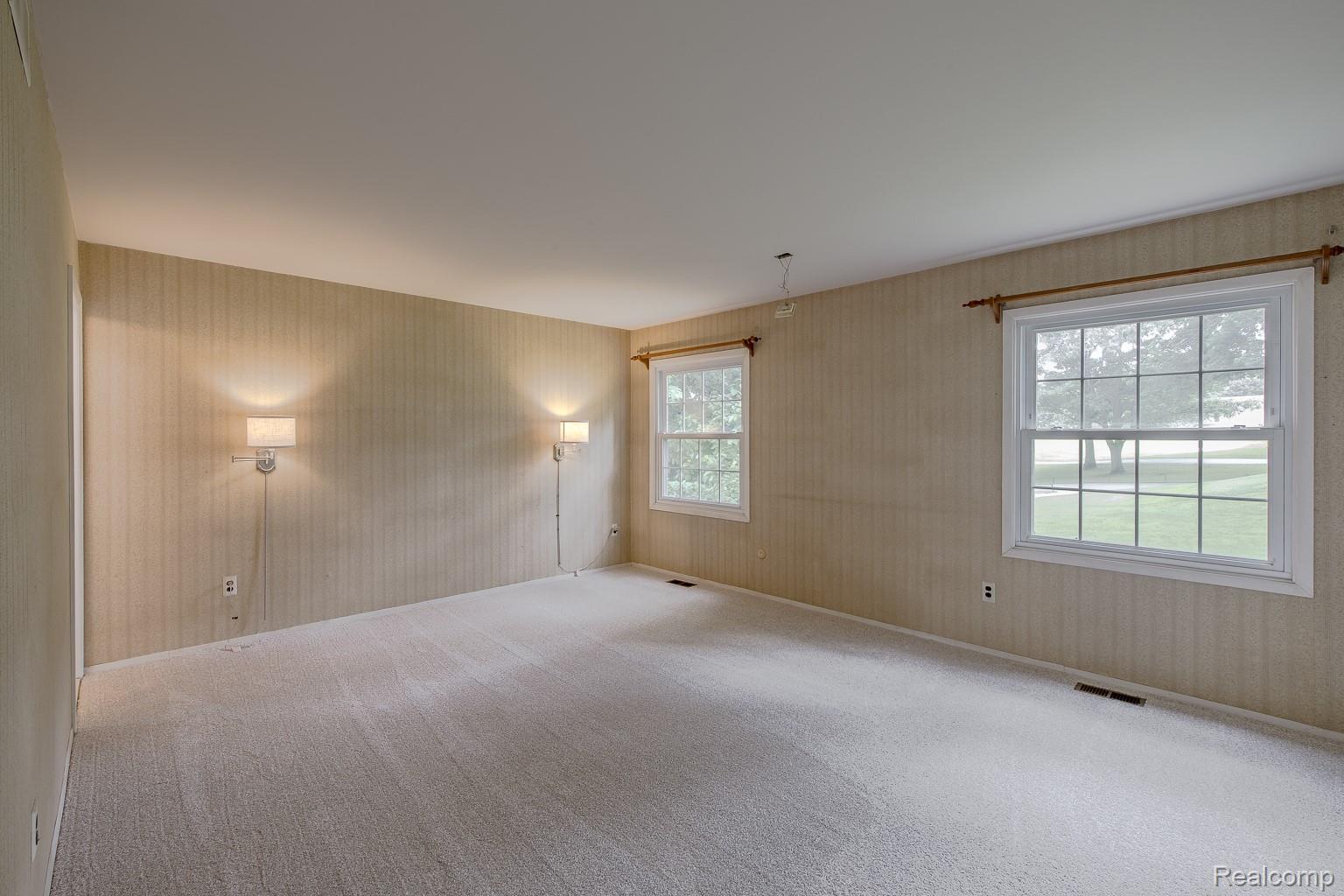 710 Basswood Drive Rochester, MI 48309 - Photo 26 of 42 Primary Bedroom with golf course view