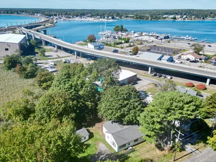 an aerial view of a house with a lake view