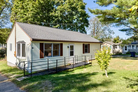 a view of a house with a yard