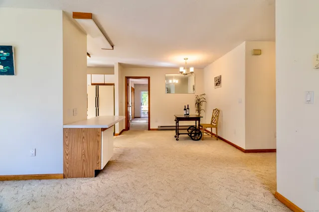 a view of a room with gym equipment and a window