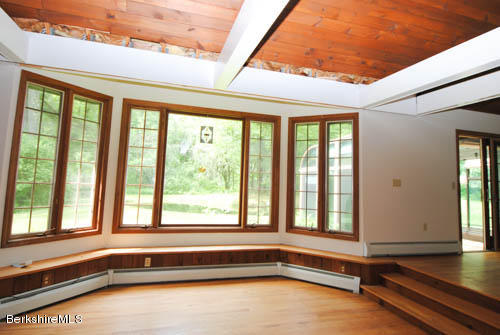 96 Scacebrook Road Richmond, MA 01201 - Photo 12 of 25 a view of an empty room with wooden floor and a window