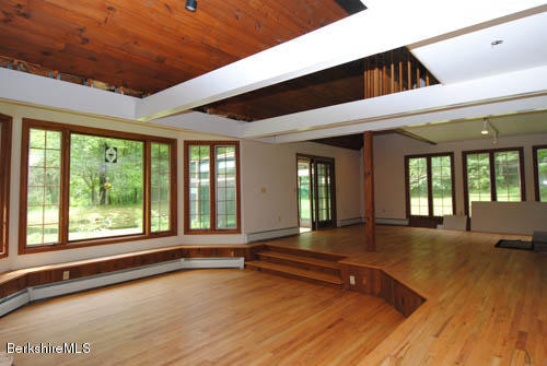 96 Scacebrook Road Richmond, MA 01201 - Photo 16 of 25 a view of an empty room with wooden floor and a window