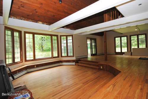 96 Scacebrook Road Richmond, MA 01201 - Photo 17 of 25 a view of empty room with wooden floor and fan