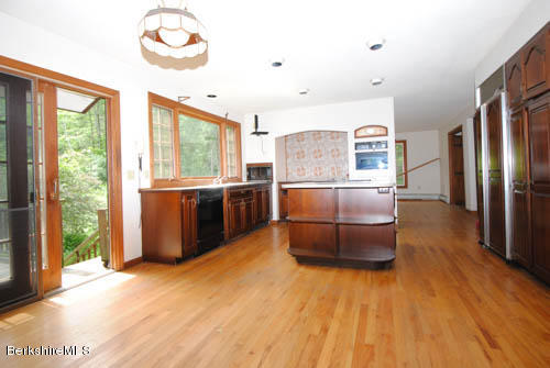 96 Scacebrook Road Richmond, MA 01201 - Photo 18 of 25 a kitchen with stainless steel appliances a refrigerator a stove a sink and a large window
