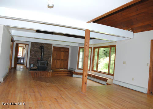 96 Scacebrook Road Richmond, MA 01201 - Photo 10 of 25 an empty room with wooden floor and windows