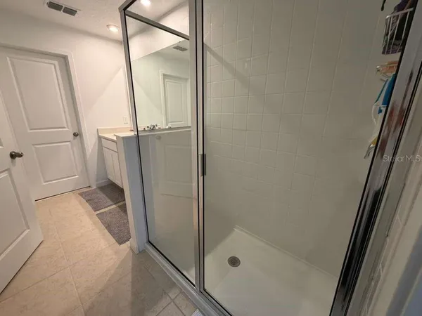 a bathroom with a tub and a shower
