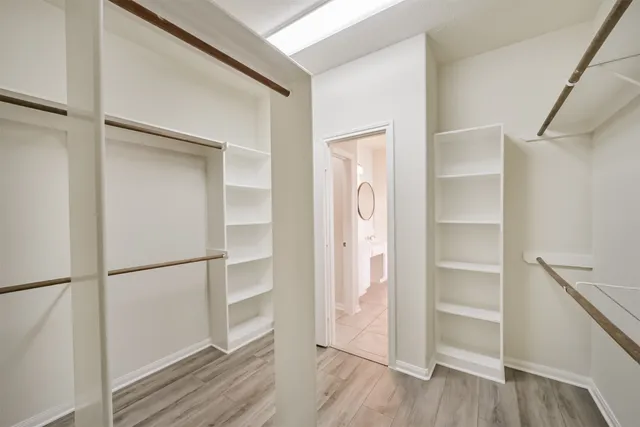 a bathroom with a sink toilet and mirror