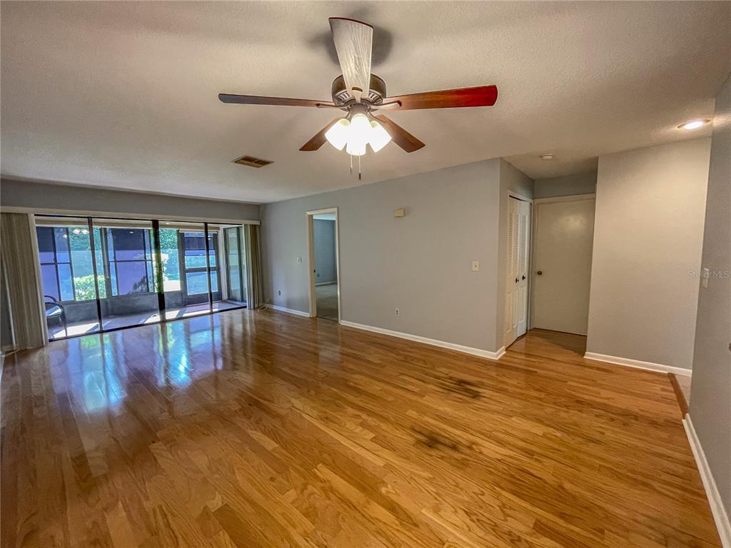 63 Douglas Street, Unit 11 Homosassa, FL 34446 - Photo 11 of 27 a view of empty room with wooden floor