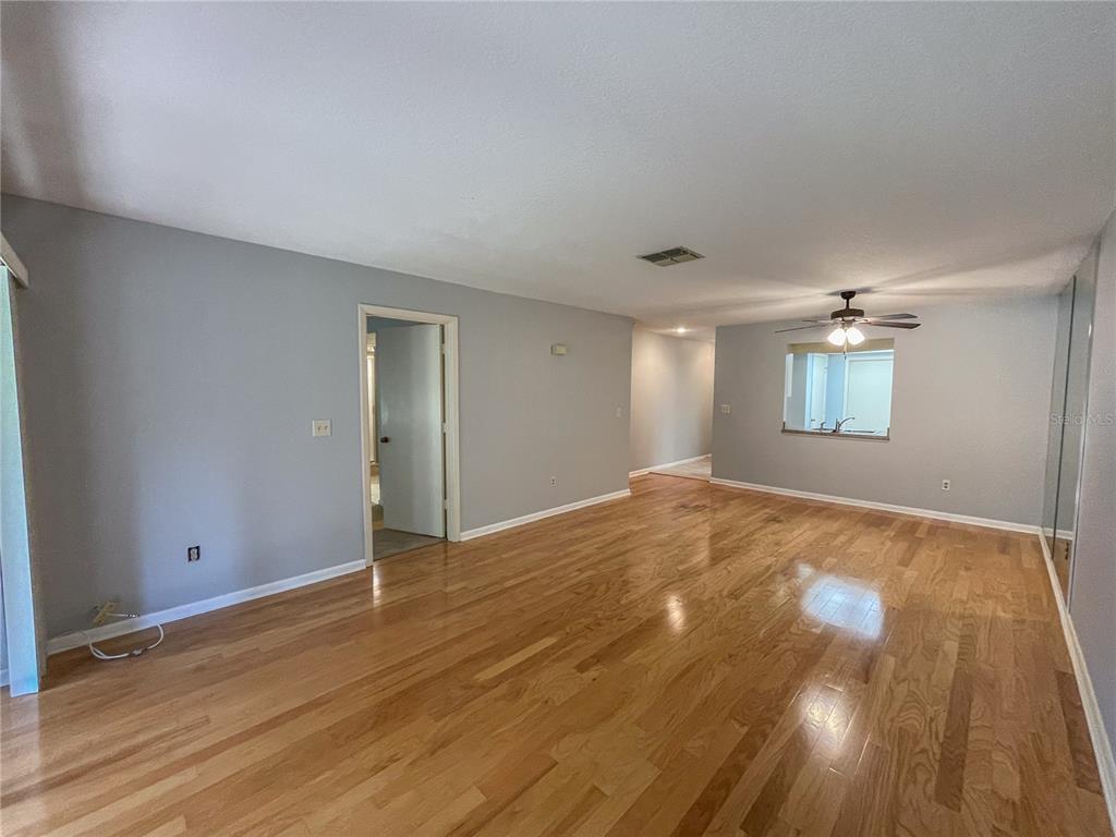 63 Douglas Street, Unit 11 Homosassa, FL 34446 - Photo 12 of 27 a view of empty room with wooden floor