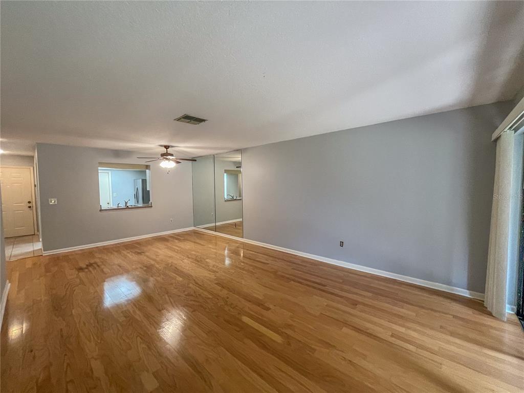 63 Douglas Street, Unit 11 Homosassa, FL 34446 - Photo 13 of 27 a view of empty room with wooden floor