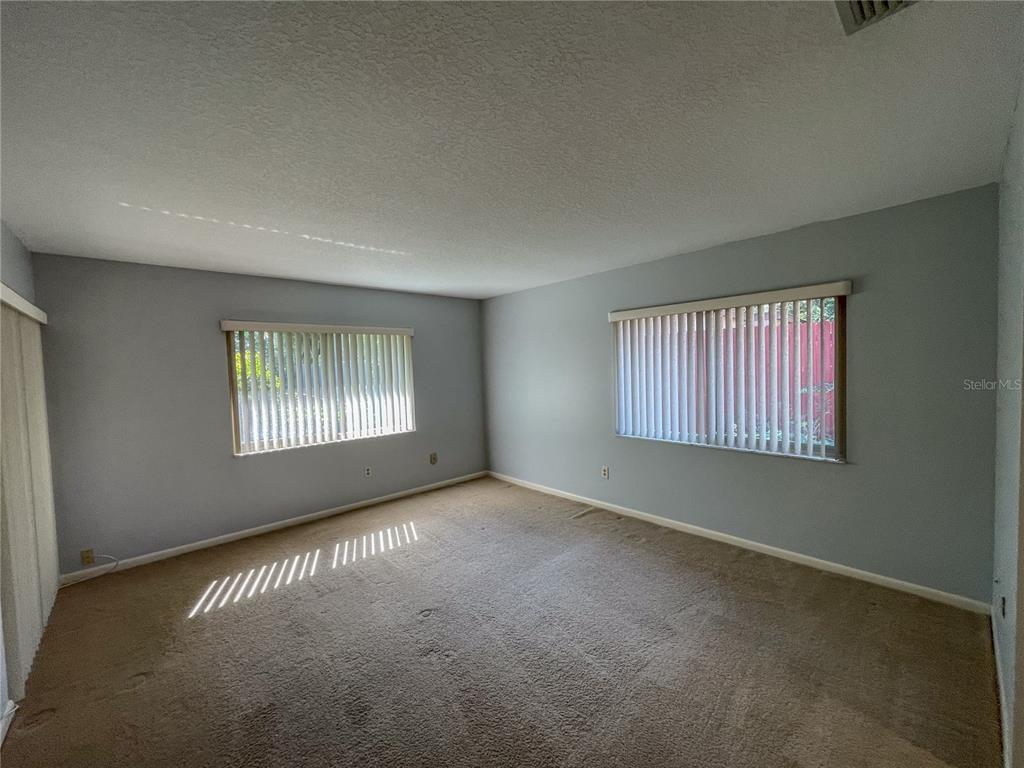 63 Douglas Street, Unit 11 Homosassa, FL 34446 - Photo 14 of 27 an empty room with windows