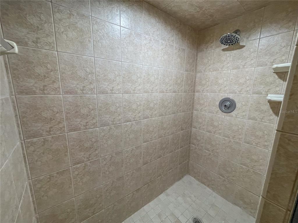 63 Douglas Street, Unit 11 Homosassa, FL 34446 - Photo 18 of 27 a bathroom with a shower