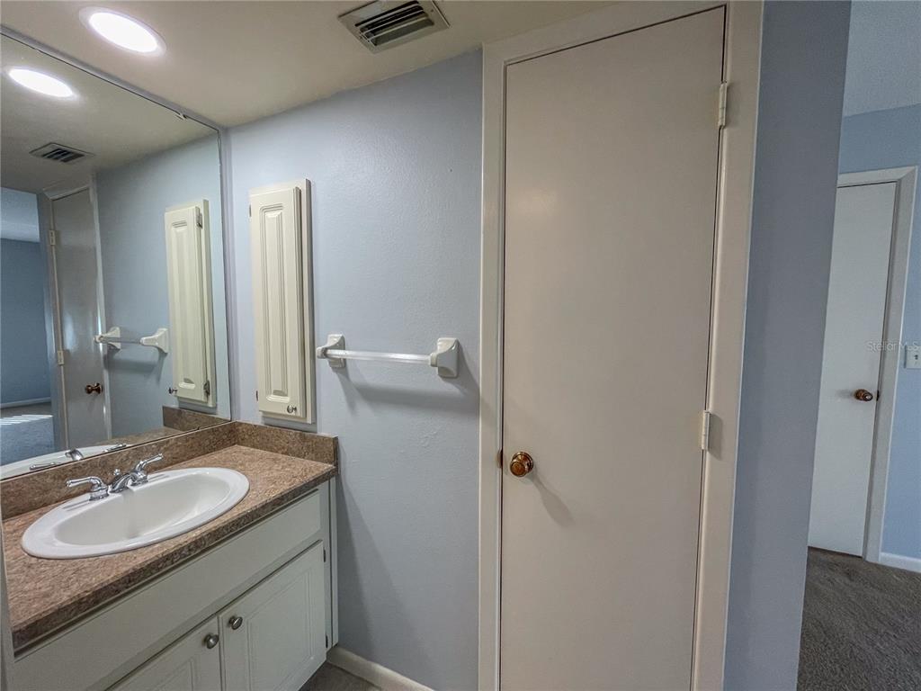 63 Douglas Street, Unit 11 Homosassa, FL 34446 - Photo 19 of 27 a bathroom with a sink and a mirror
