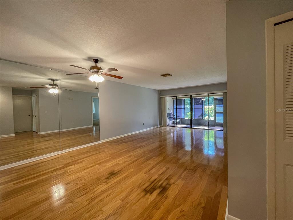 63 Douglas Street, Unit 11 Homosassa, FL 34446 - Photo 2 of 27 a view of empty room with wooden floor
