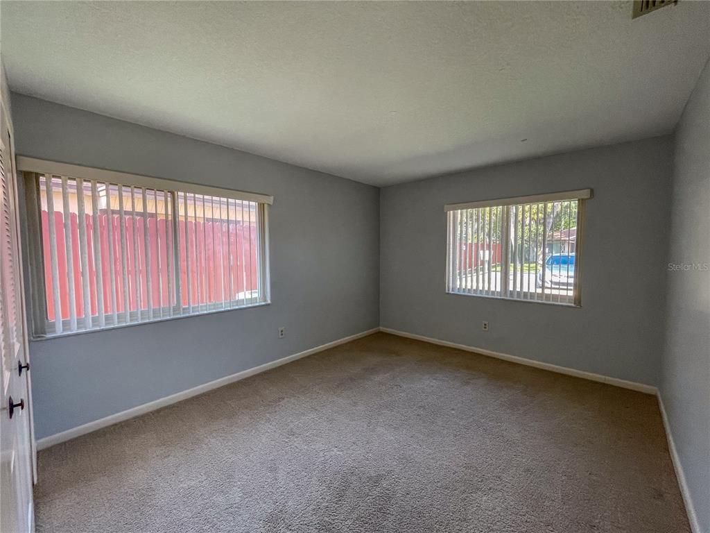 63 Douglas Street, Unit 11 Homosassa, FL 34446 - Photo 21 of 27 an empty room with windows