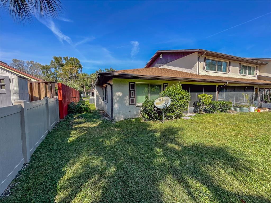 63 Douglas Street, Unit 11 Homosassa, FL 34446 - Photo 26 of 27 a front view of a house with garden