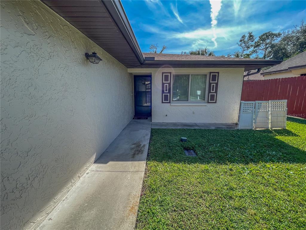 63 Douglas Street, Unit 11 Homosassa, FL 34446 - Photo 6 of 27 a view of house with backyard