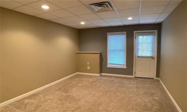 a view of an empty room with a window