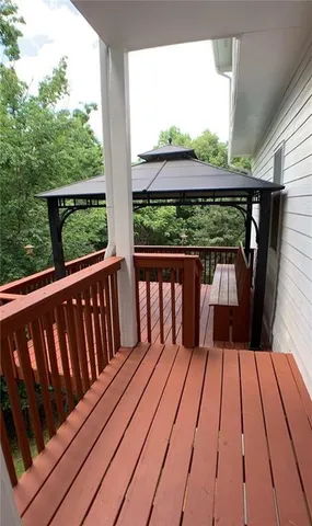 a view of balcony with wooden floor