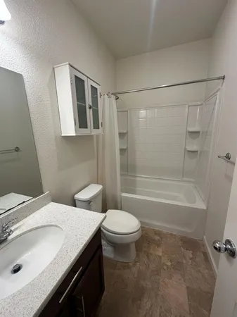 a view of room with a ceiling fan and window