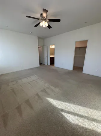 a bathroom with a sink a toilet a mirror and shower