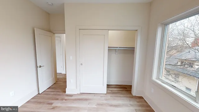 a view of entryway with wooden floor