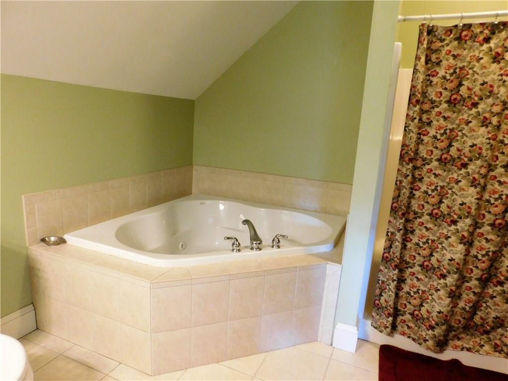 184 Ridge Road, Unit 23 Portland, ME 04103 - Photo 30 of 35 The master bath has both a shower...