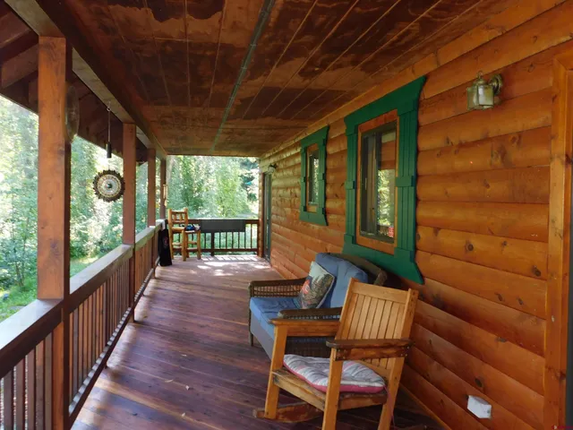 a view of two chairs in the balcony