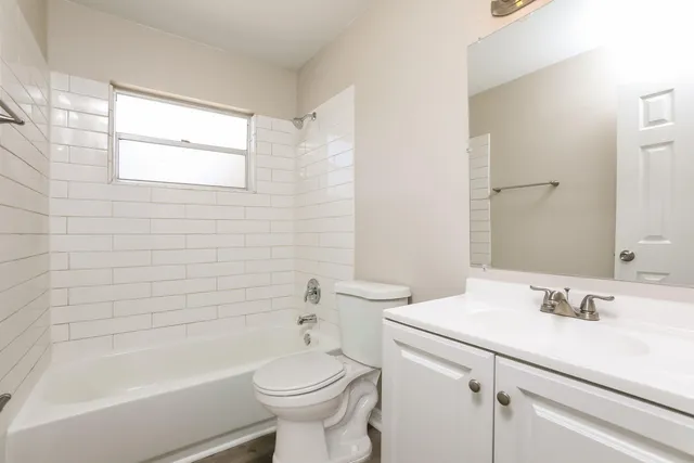 a bathroom with a sink toilet and bathtub