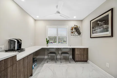 a kitchen with stainless steel appliances kitchen island granite countertop a sink stove and cabinets