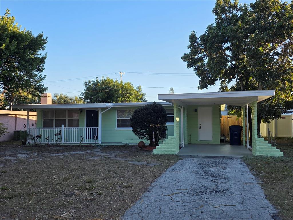 298 11th Avenue Southwest Largo, FL 33770 - Photo 2 of 34 a front view of a house with garden