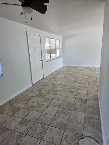 a kitchen with stainless steel appliances a sink stove and cabinets
