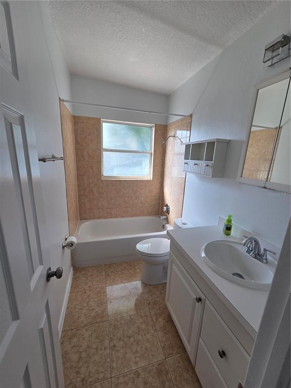298 11th Avenue Southwest Largo, FL 33770 - Photo 27 of 34 a bathroom with a sink a toilet and shower