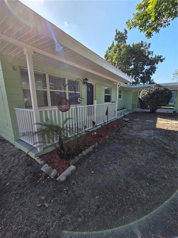298 11th Avenue Southwest Largo, FL 33770 - Photo 31 of 34 a view of a house with backyard and sitting area