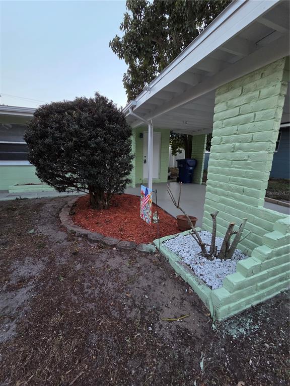 298 11th Avenue Southwest Largo, FL 33770 - Photo 7 of 34 a front view of a house with a yard