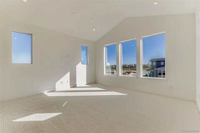 a view of a livingroom with wooden floor and a large window