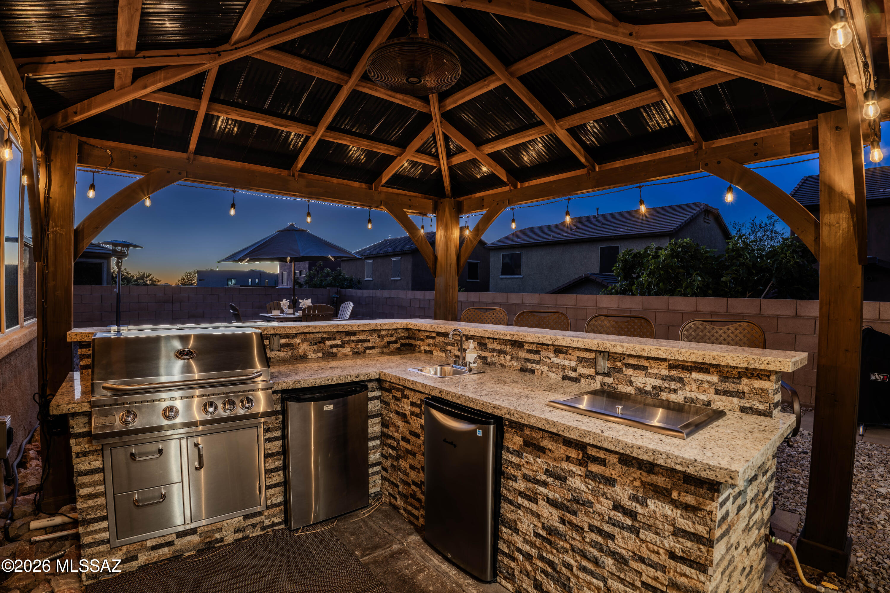 211 East Refuge Loop Vail, AZ 85641 - Photo 1 of 48 a view of a barbecue grill and wooden floor