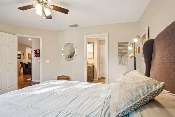 a living room with furniture kitchen and a table