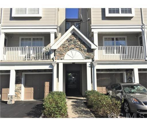 a view of a house with a small yard