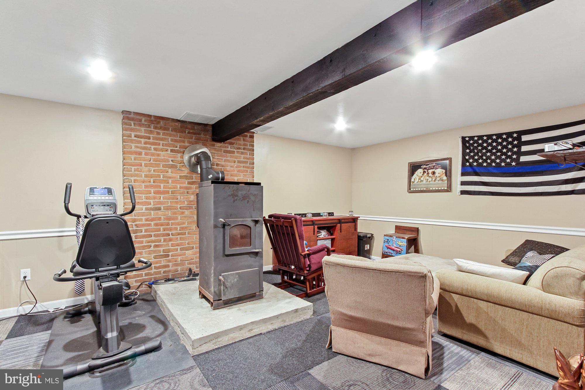 295 Shenks Ferry Road Conestoga, PA 17516 - Photo 15 of 25 Finished lower level with coal stove